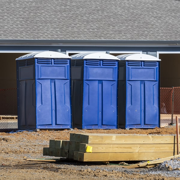 what is the cost difference between standard and deluxe porta potty rentals in Herron MI